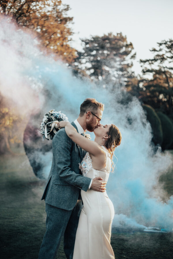 blue smoke wedding couple